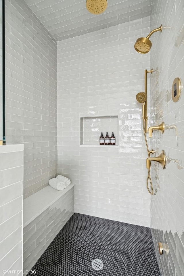 bathroom with a tile shower