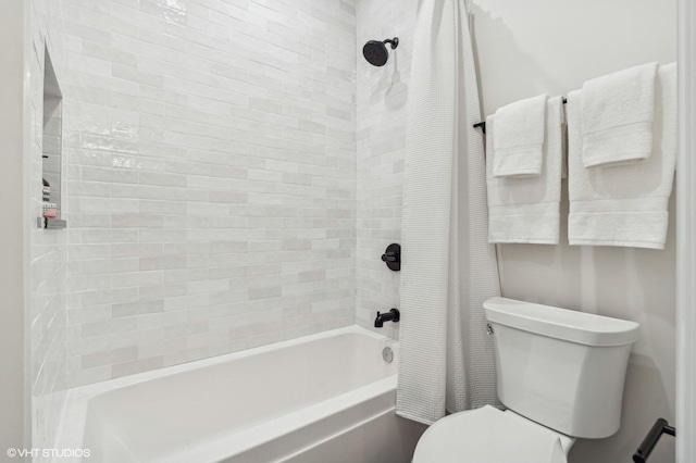 bathroom with toilet and shower / tub combo with curtain