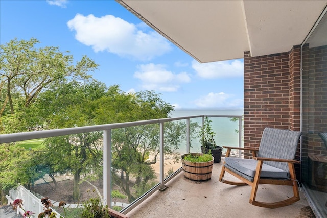 balcony featuring a water view