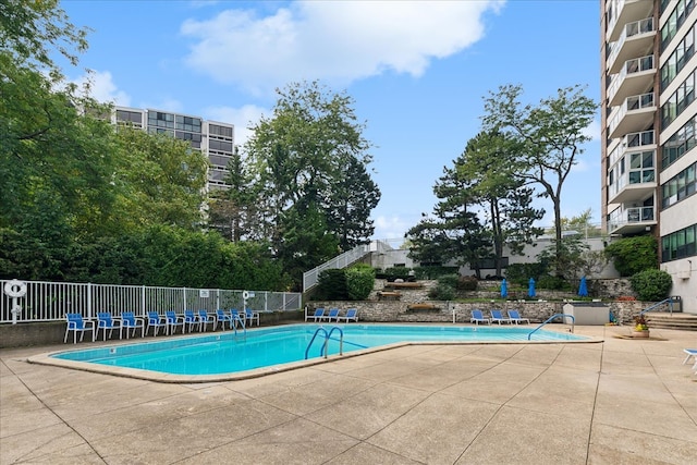 view of pool featuring a patio