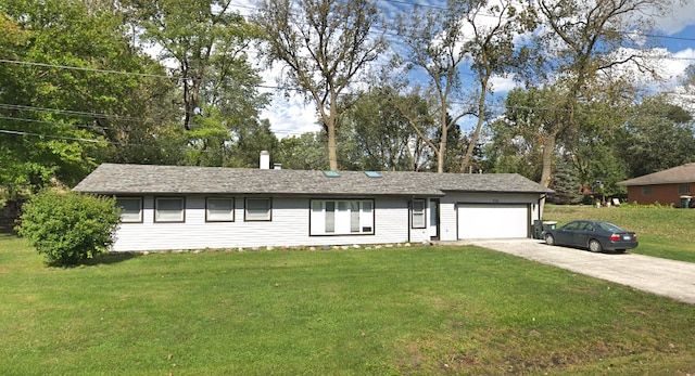 ranch-style home with a front yard and a garage