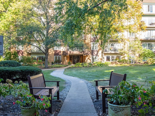 view of property's community with a yard