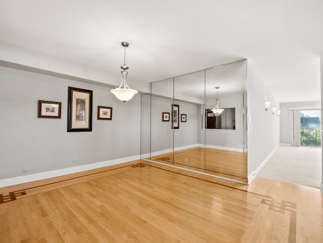 spare room with hardwood / wood-style floors