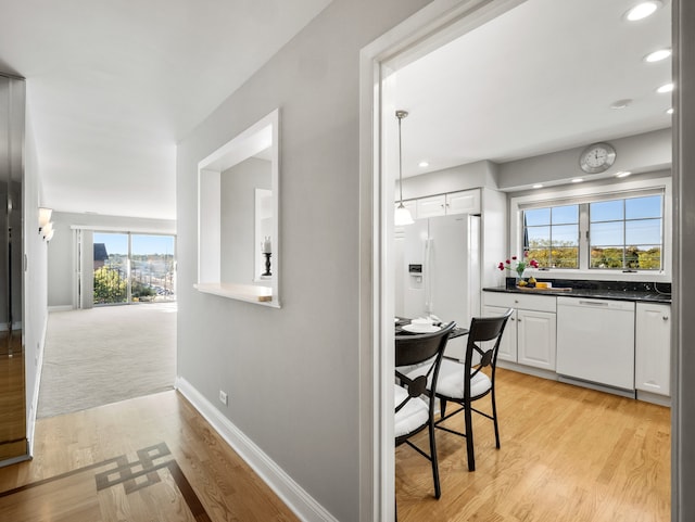 interior space with a wealth of natural light and light wood-type flooring