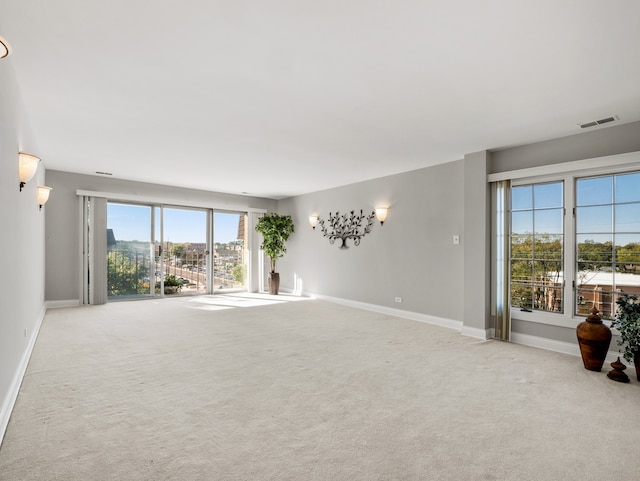 spare room with light colored carpet