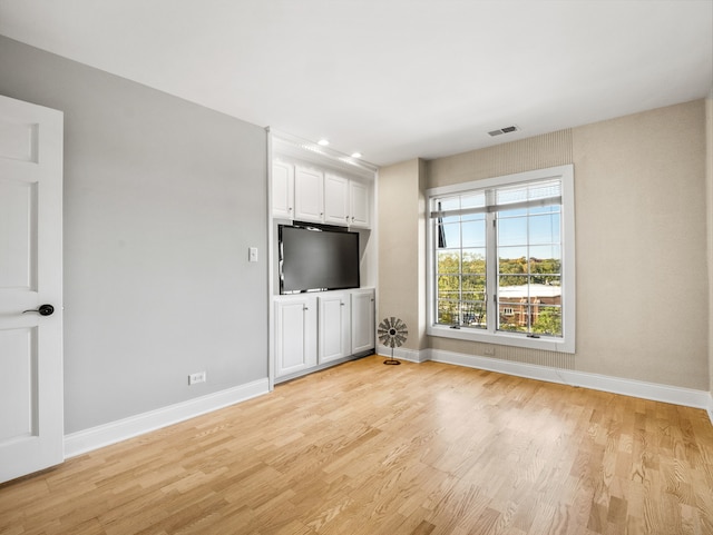 unfurnished living room with light hardwood / wood-style floors