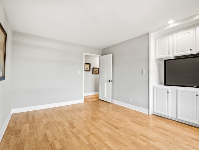 unfurnished living room featuring light wood-type flooring