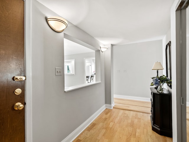 corridor featuring light hardwood / wood-style floors