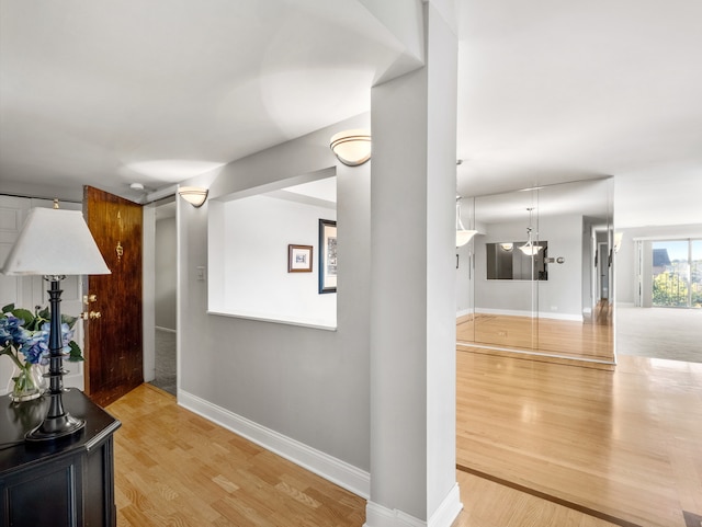 corridor featuring hardwood / wood-style flooring