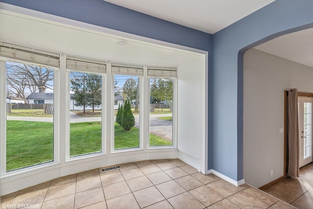 interior space with a wealth of natural light and light tile patterned flooring