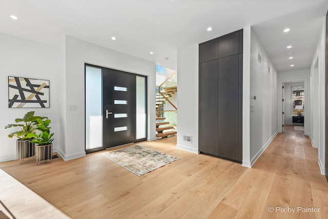 foyer entrance featuring light hardwood / wood-style flooring