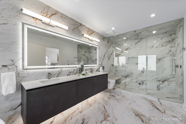 bathroom featuring vanity, a shower with shower door, toilet, and tile walls