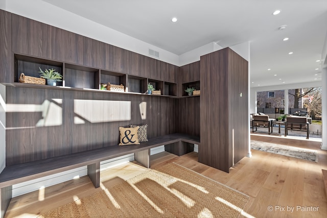 mudroom with light hardwood / wood-style flooring