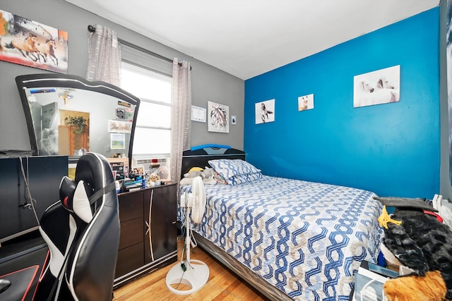 bedroom with wood-type flooring