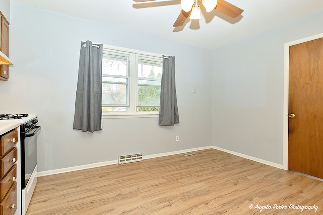 interior space with ceiling fan and light wood-type flooring