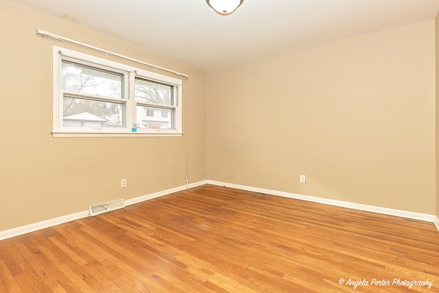 spare room with light wood-type flooring