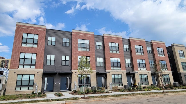 view of building exterior with central AC