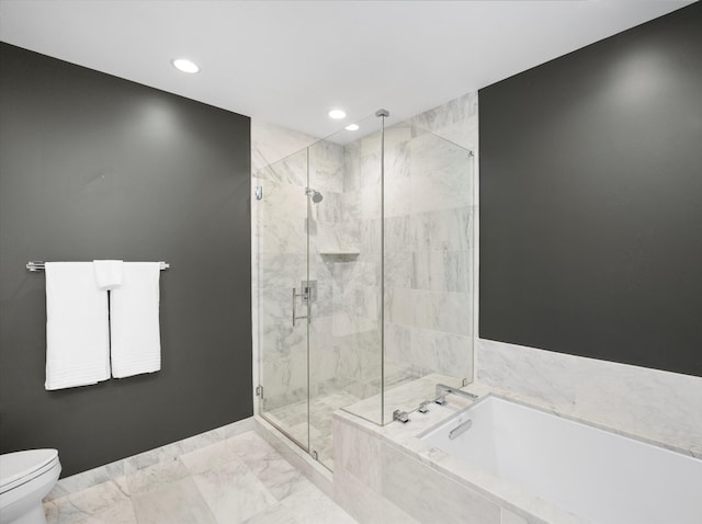 bathroom with toilet and shower with separate bathtub