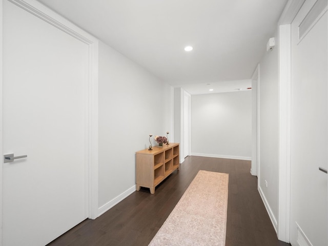 corridor with dark wood-type flooring