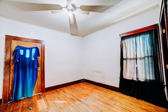 unfurnished room with hardwood / wood-style flooring and ceiling fan