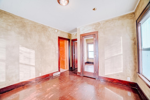 unfurnished room featuring hardwood / wood-style floors