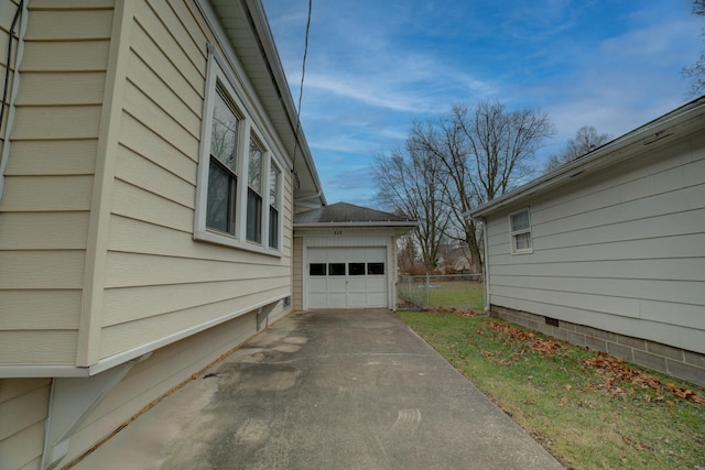 view of side of home with a garage