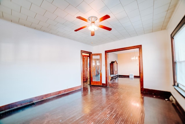 unfurnished room with ceiling fan, plenty of natural light, and hardwood / wood-style floors