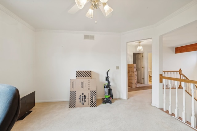 carpeted bedroom featuring ceiling fan and ornamental molding