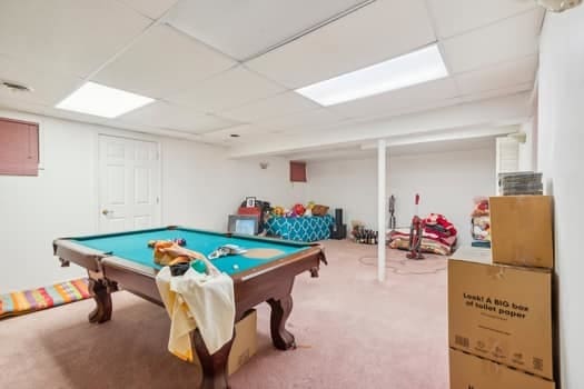 game room with carpet flooring, a drop ceiling, and pool table