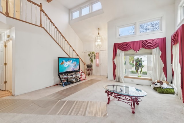 interior space featuring a high ceiling and a chandelier