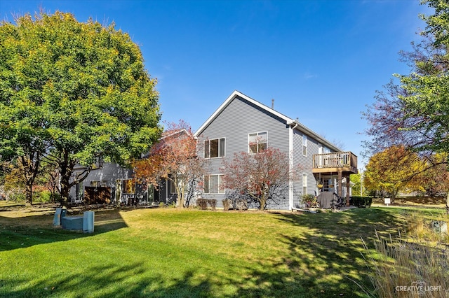 back of house featuring a yard