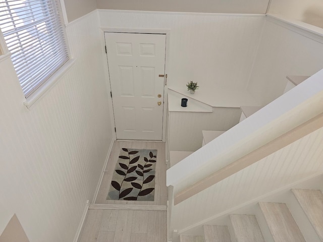 staircase featuring wood-type flooring