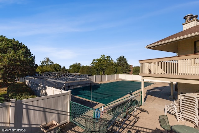 view of pool featuring a patio area