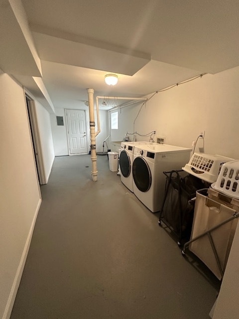 clothes washing area featuring independent washer and dryer