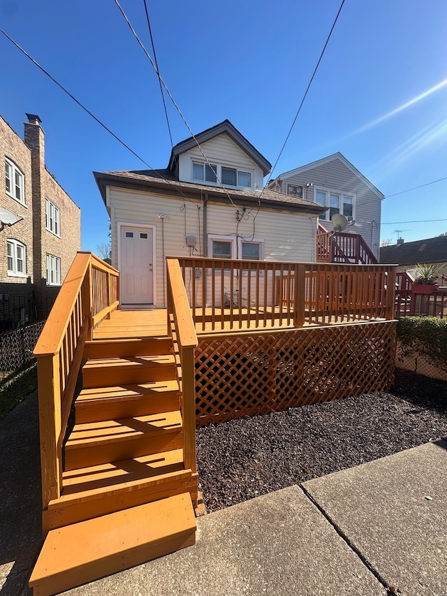 back of house featuring a deck