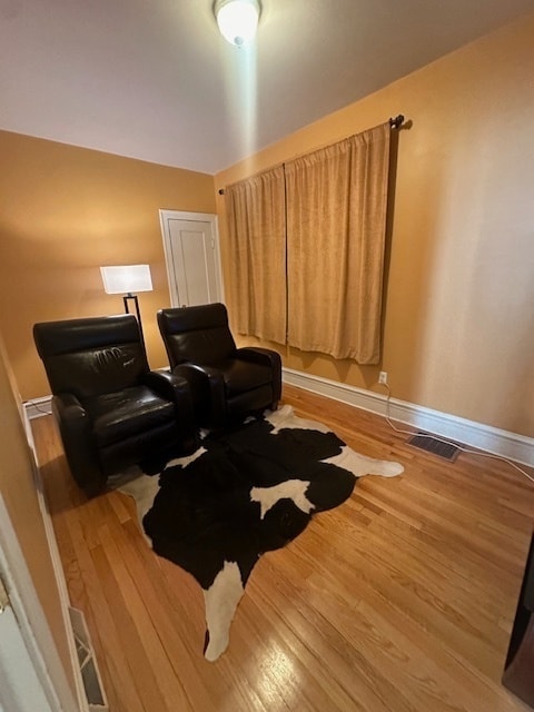 living area with wood-type flooring