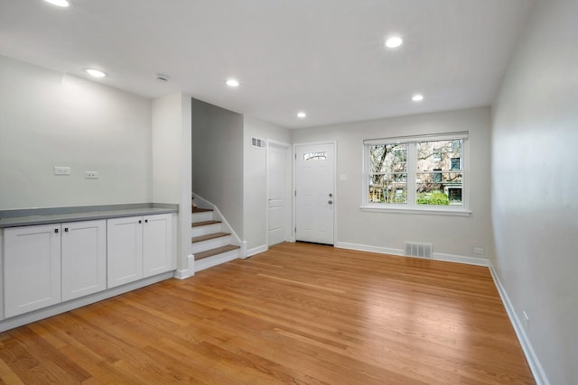 empty room with light hardwood / wood-style floors