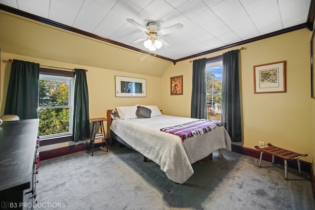 bedroom with lofted ceiling, ornamental molding, carpet flooring, and ceiling fan