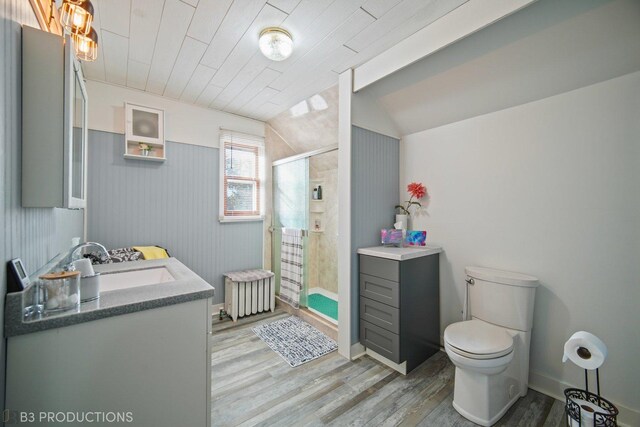248 N Rohlwing Rd, Palatine, IL 60074 - bathroom featuring radiator heating unit, wood finished floors, vanity, toilet, and vaulted ceiling