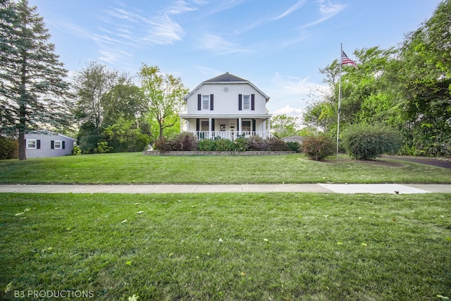 view of front of home featuring covered porch and a front yard