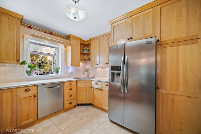 kitchen featuring decorative backsplash, light tile patterned flooring, decorative light fixtures, and stainless steel appliances