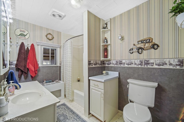248 N Rohlwing Rd, Palatine, IL 60074 - bathroom featuring wallpapered walls, vanity, toilet, shower / tub combo with curtain, and a wainscoted wall