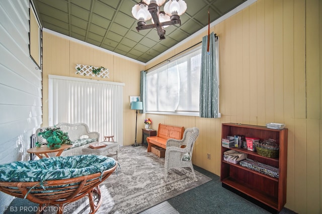 sunroom / solarium featuring a notable chandelier