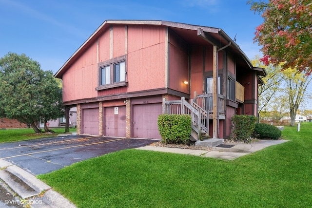 view of property exterior with a garage and a lawn