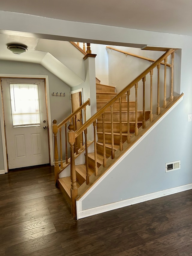 stairs with wood-type flooring