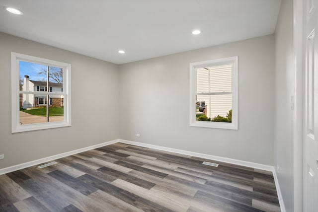 empty room featuring dark hardwood / wood-style flooring