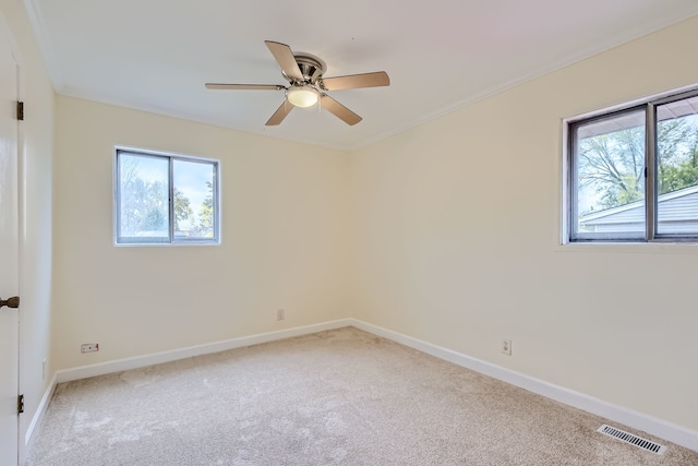 carpeted empty room featuring ceiling fan