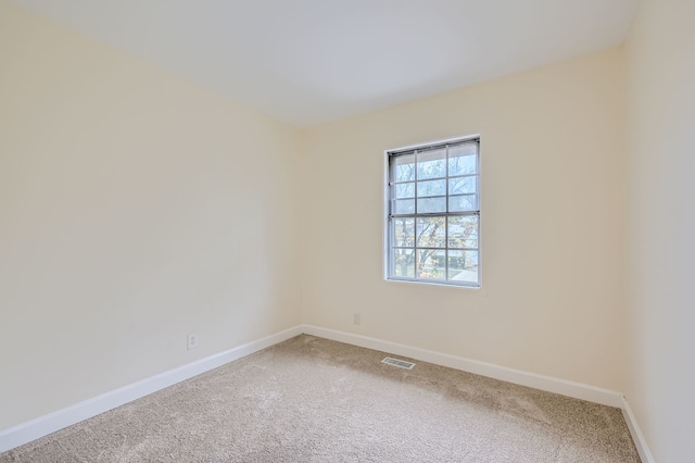 unfurnished room with carpet flooring