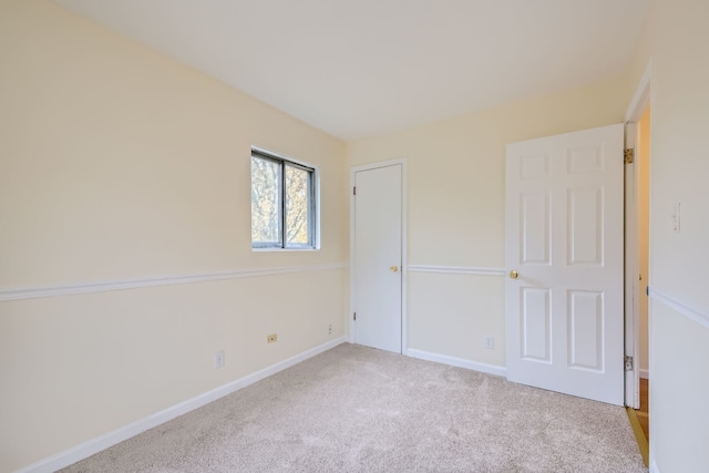 unfurnished bedroom featuring light colored carpet