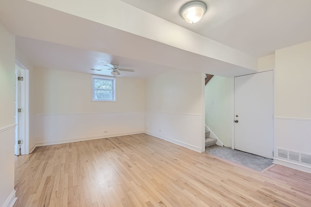 spare room featuring light hardwood / wood-style floors and ceiling fan